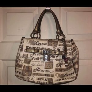 Tan Purse With Graphics and Charms